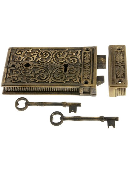 Solid Brass Scroll Rim Lock in Antique Brass.